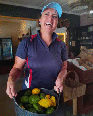 A Floreer team member with a basket of fresh local produce